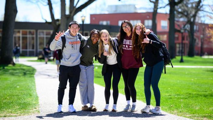 Springfield College students gather for a group photo on the Naismith Green on a warm spring day